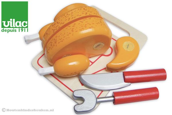 Geroosterde kip met snijplank en snijset.